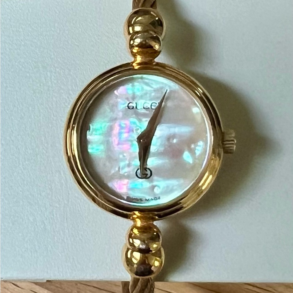 Gucci Gold Bangle Watch with Iridescent Dial and Flexible Band